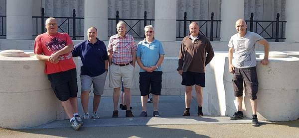 Image may contain: 2 people, people smiling, people standing, shoes and outdoor